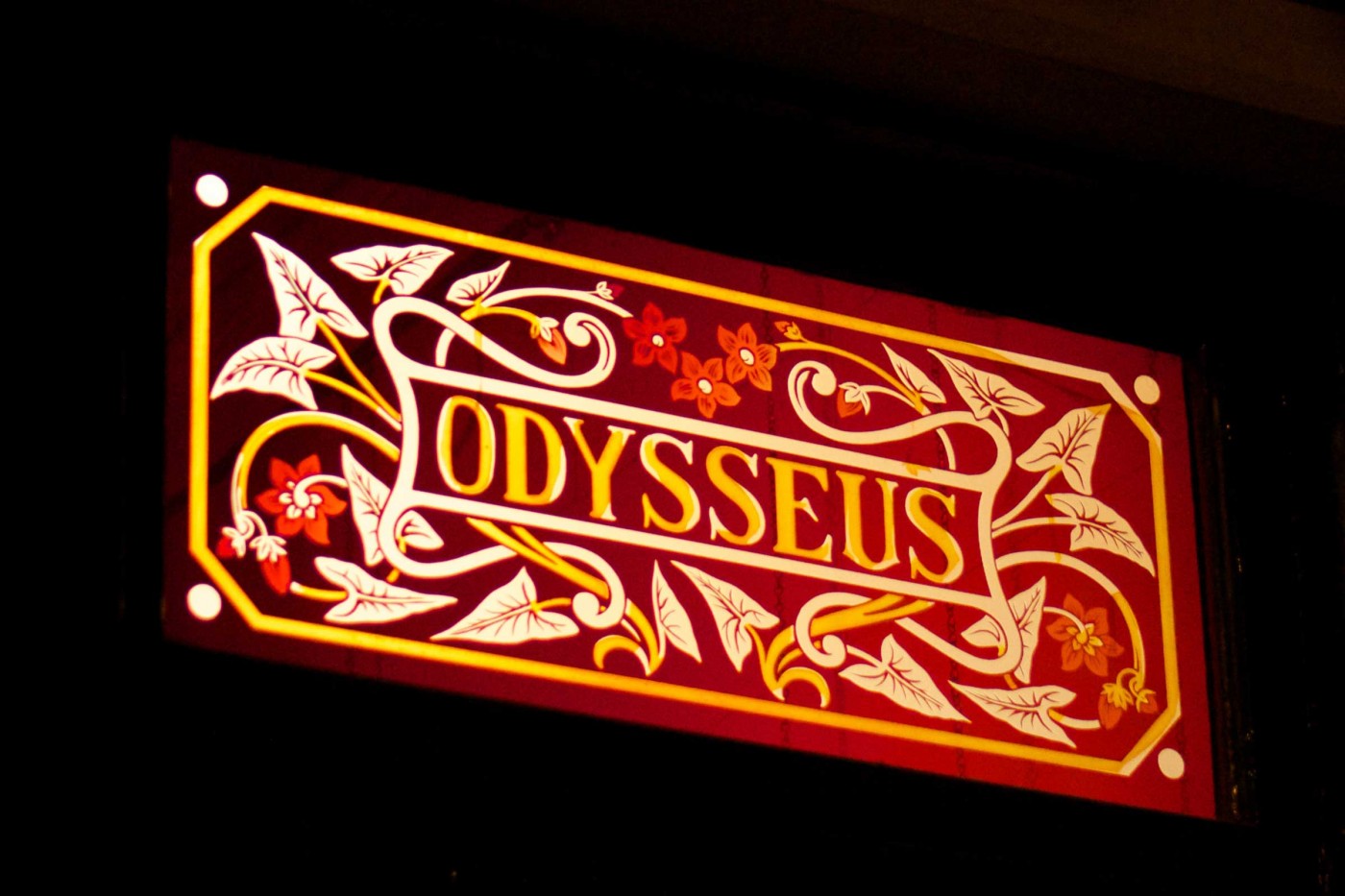 Stained glass window with the word Odysseus